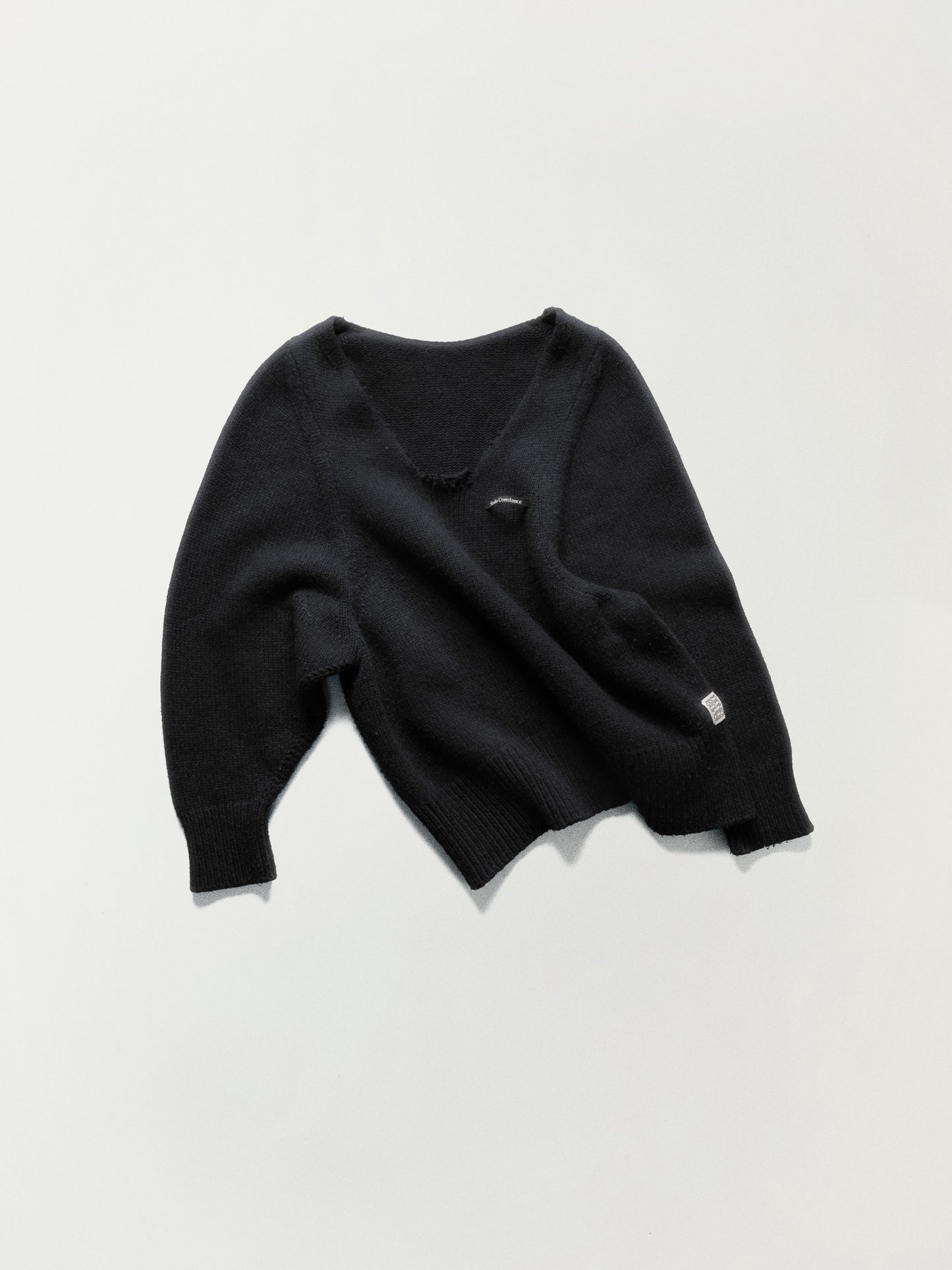 DECONSTRUCTED V-NECK SWEATER